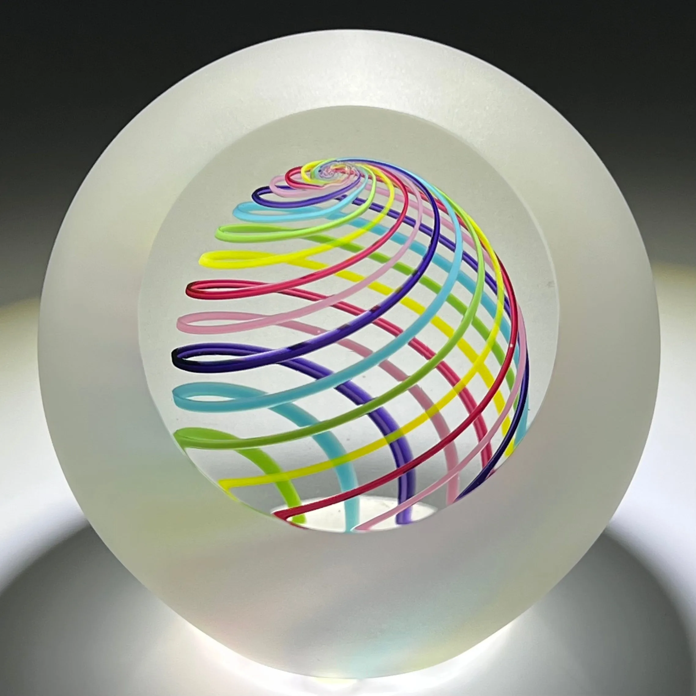 Signed Paul Harrie Contemporary Glass Art Paperweight With Spiral Rainbow Design and Faceted Frosted Surface