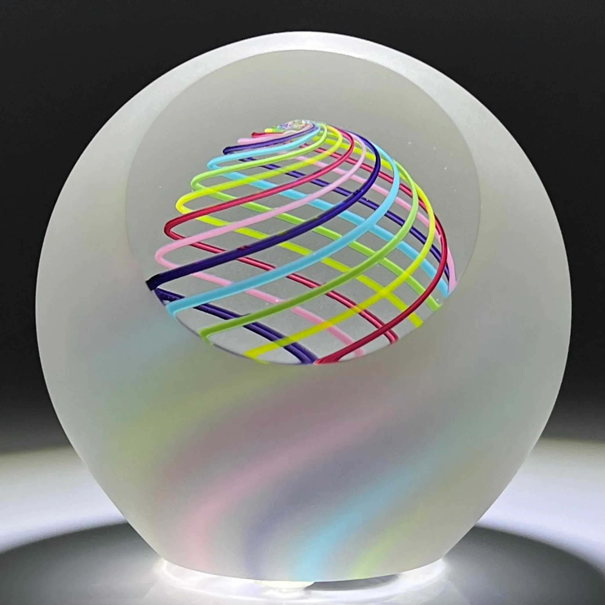 Signed Paul Harrie Contemporary Glass Art Paperweight With Spiral Rainbow Design and Faceted Frosted Surface