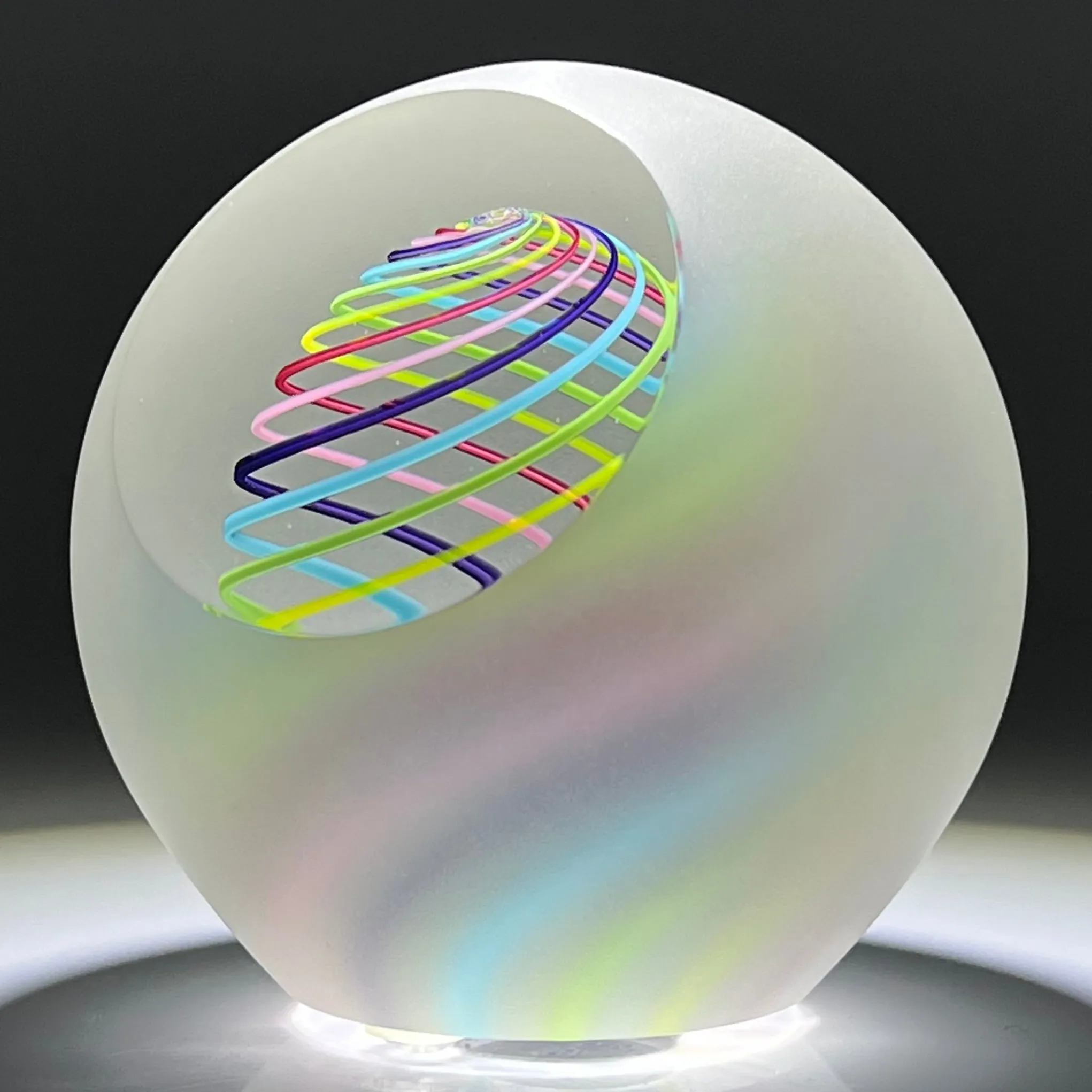 Signed Paul Harrie Contemporary Glass Art Paperweight With Spiral Rainbow Design and Faceted Frosted Surface